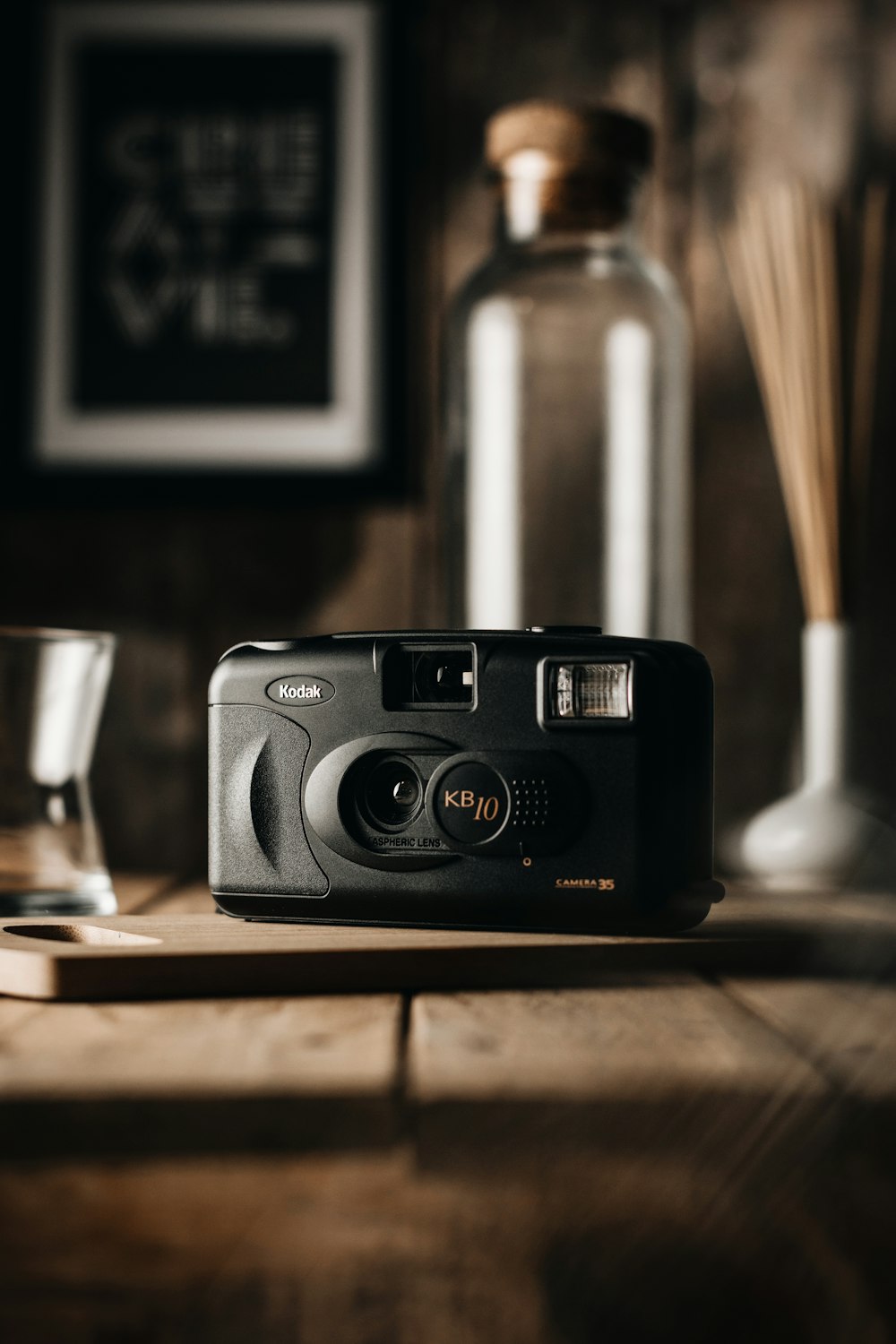 black and silver camera on brown wooden table