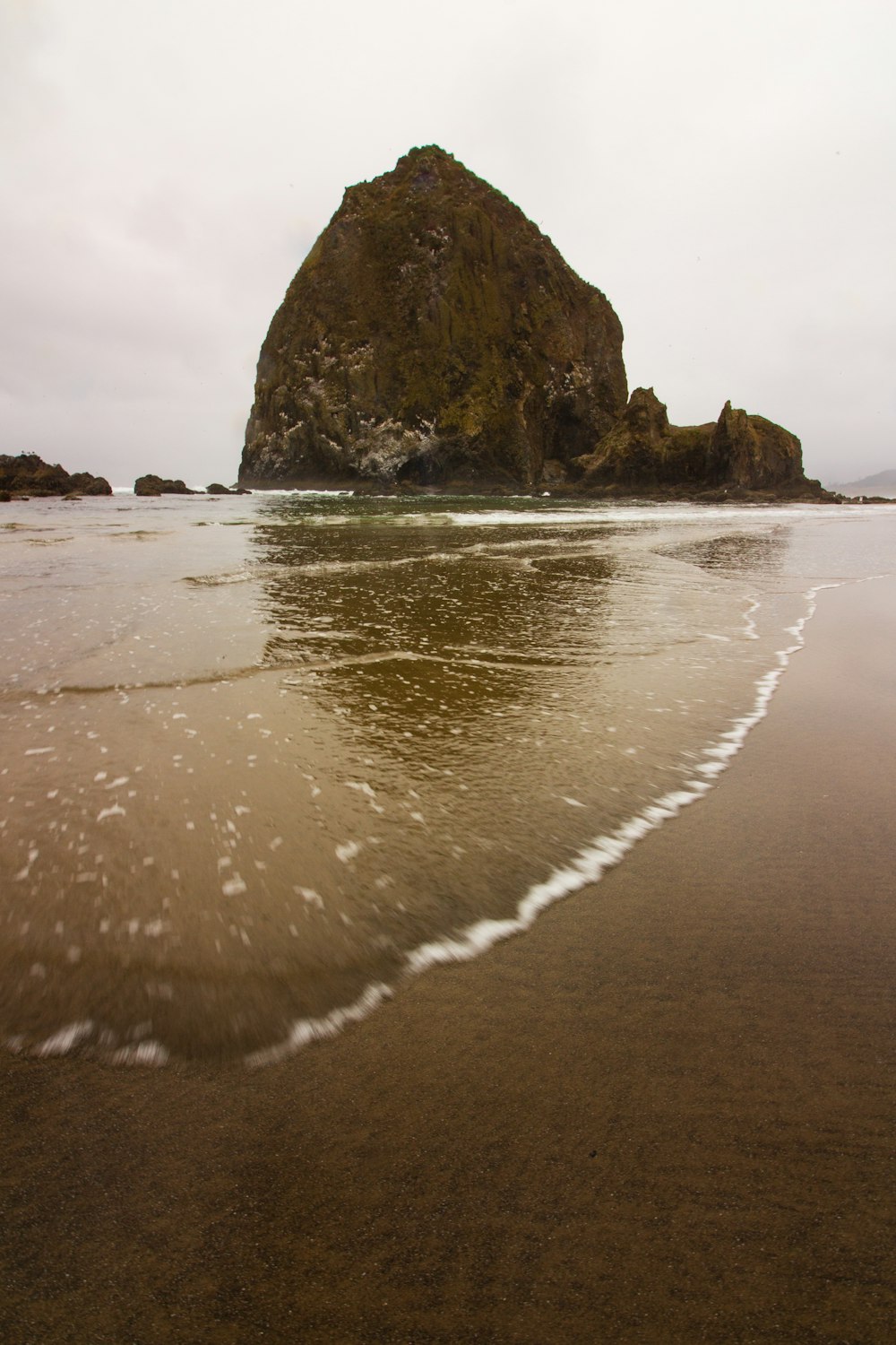 brown rock formation on sea shore during daytime