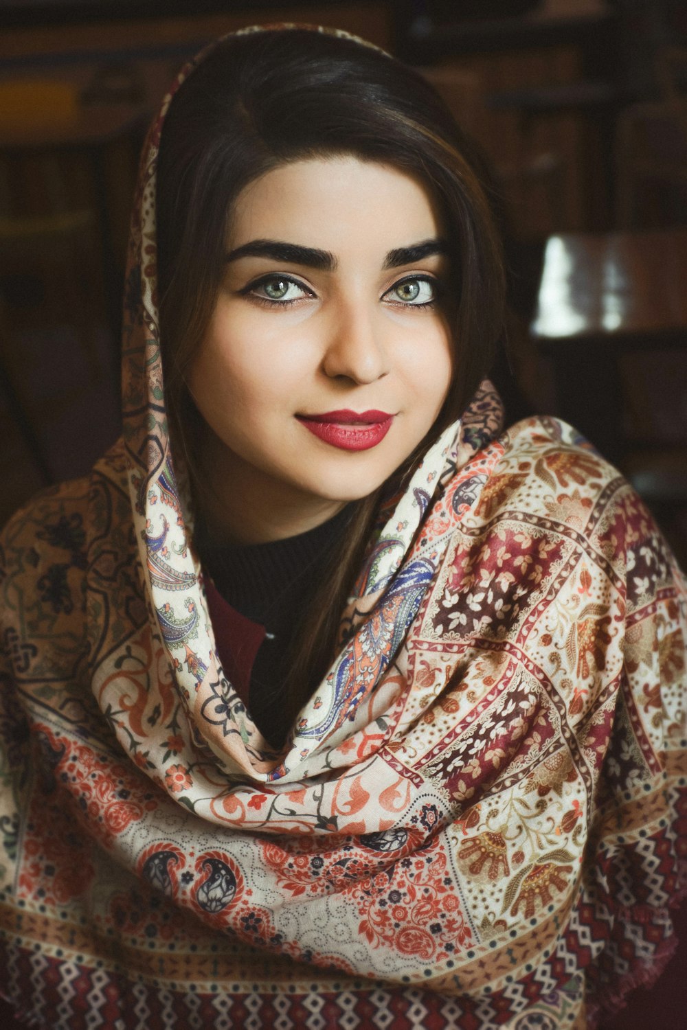 woman in red and white floral hijab