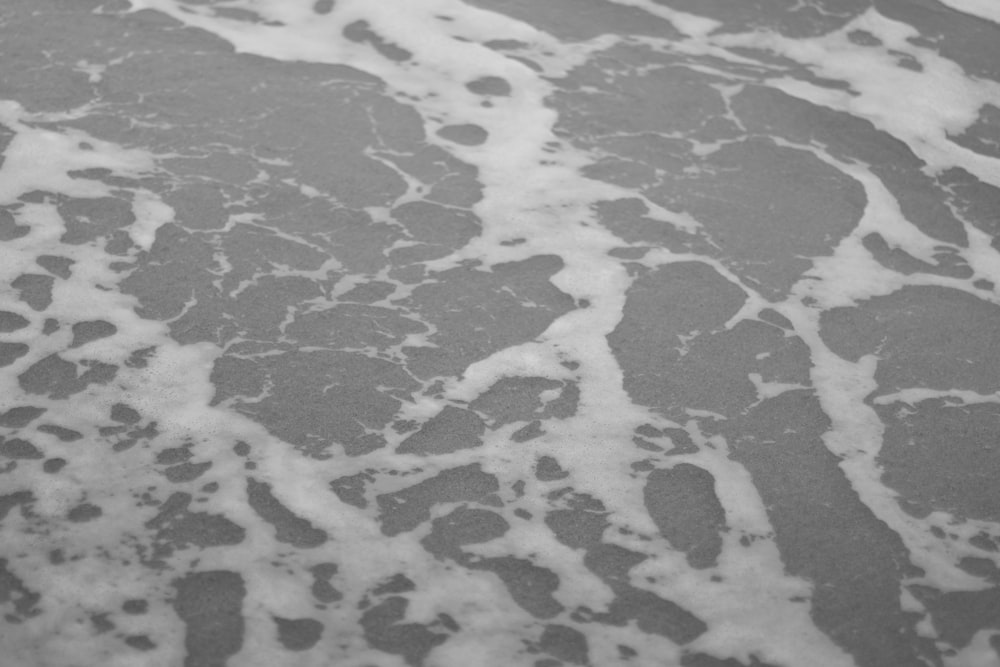 water waves on white sand
