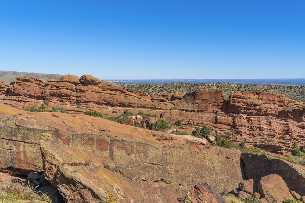 brown rocky mountain under blue sky during daytime