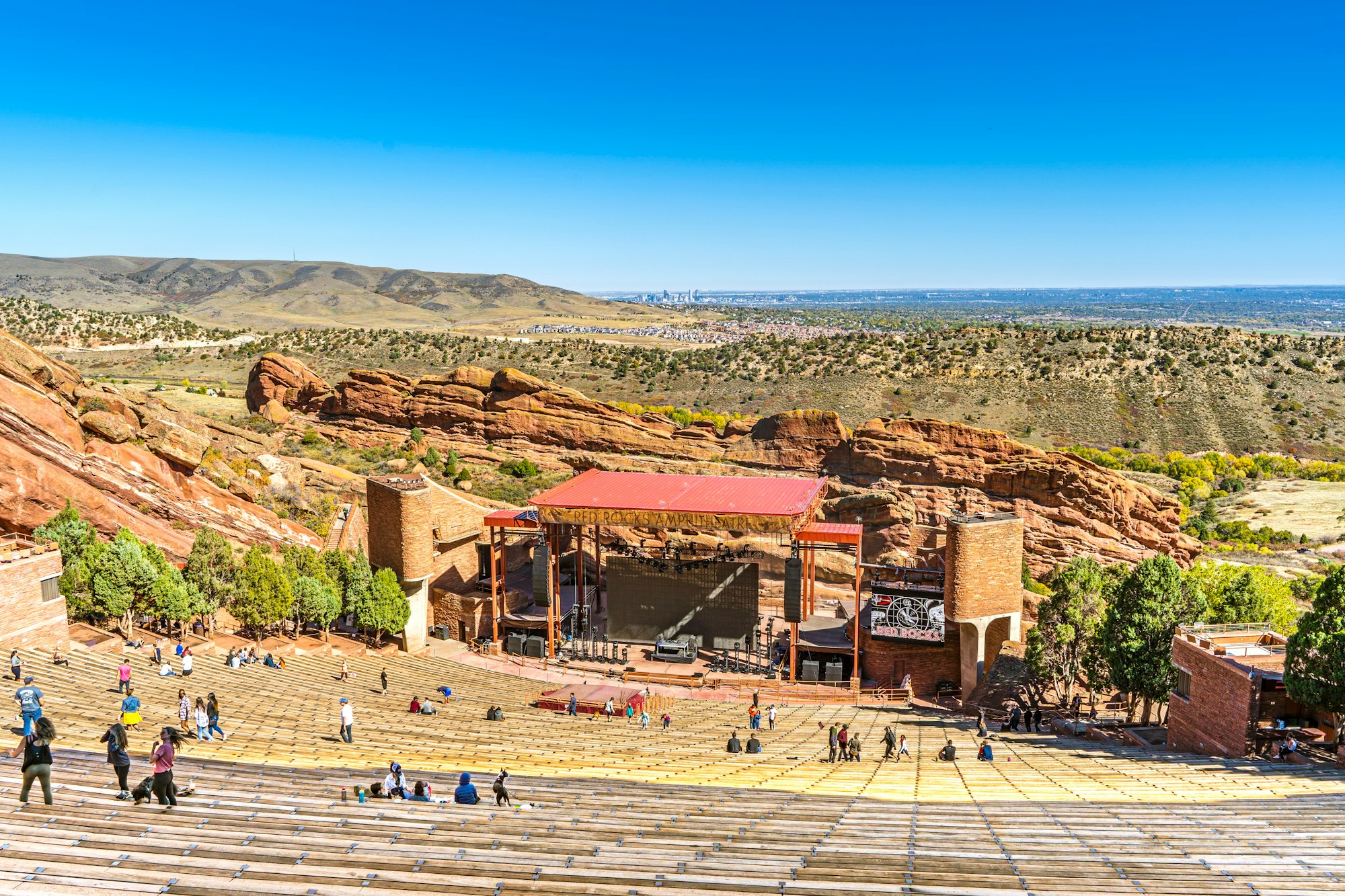 Red Rocks Park and Amphitheater captured from the top looking out onto the beautiful horizon with the stage centered.