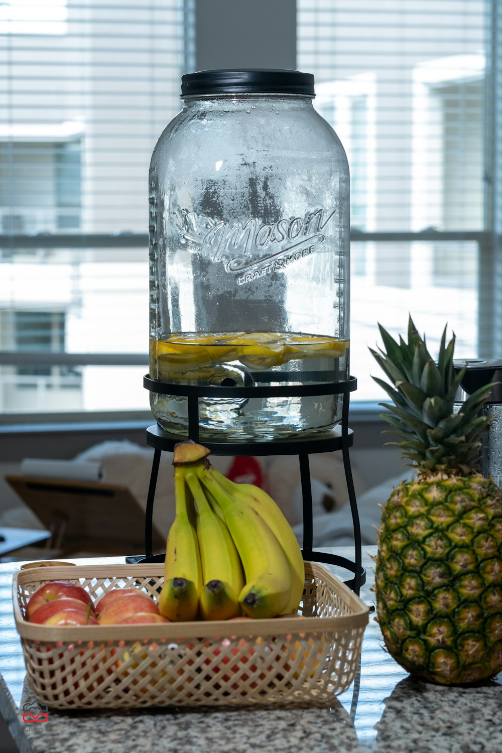 yellow banana fruit beside clear glass bottle