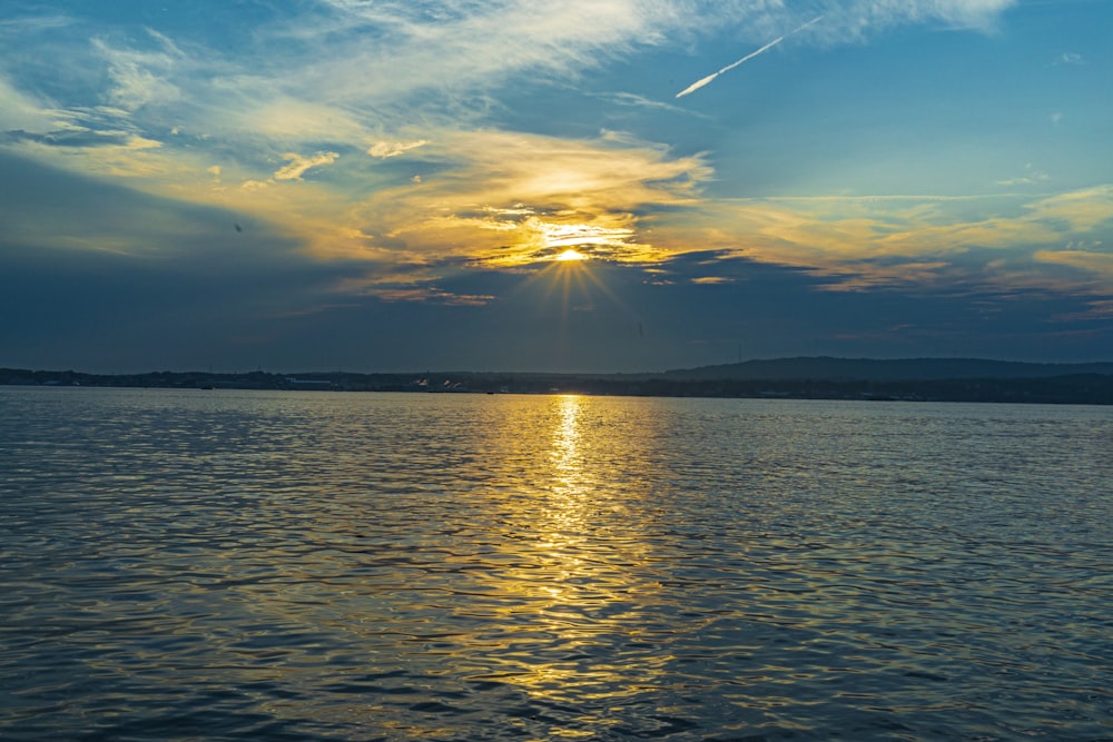 body of water during sunset