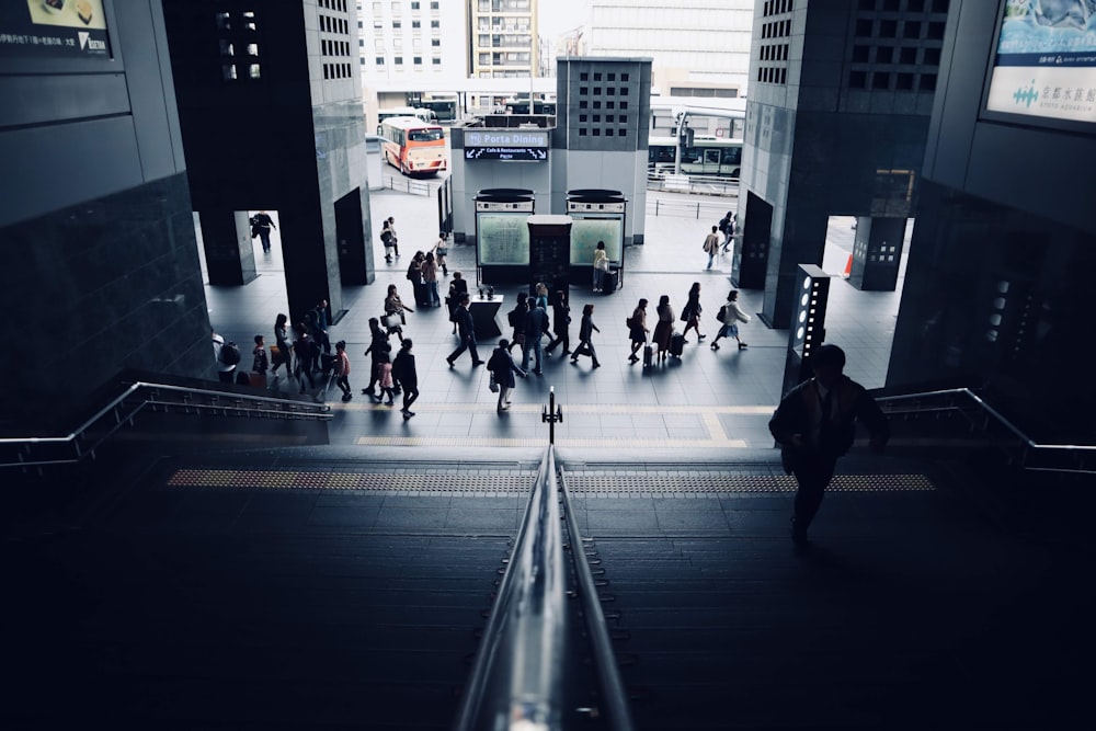 people walking on a hallway