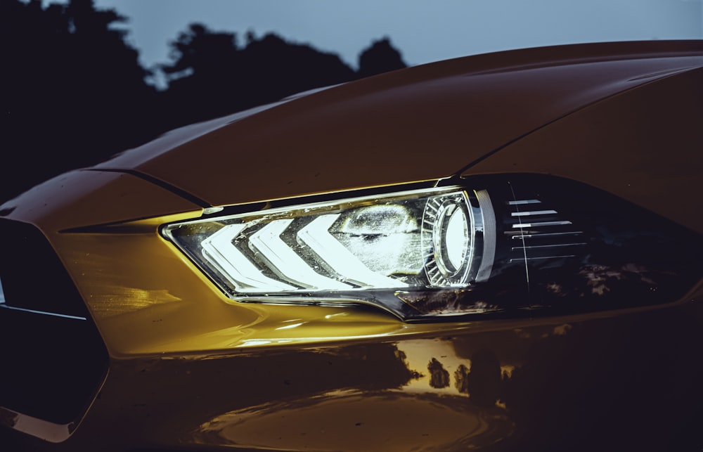 yellow car with silver car plate