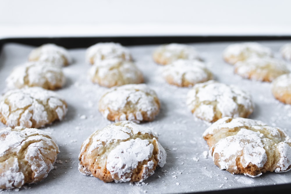 white and brown cookies on black tray