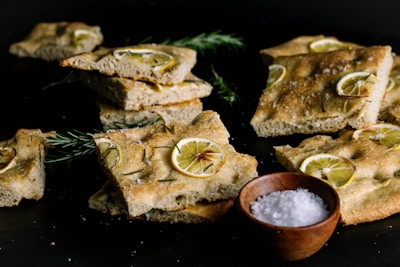 Freshly baked focacce with rosemary and sea salt on a wooden board