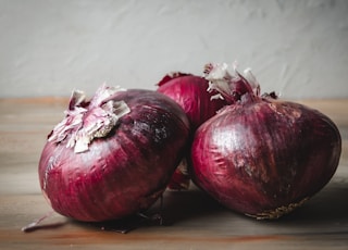 red onion on brown wooden table