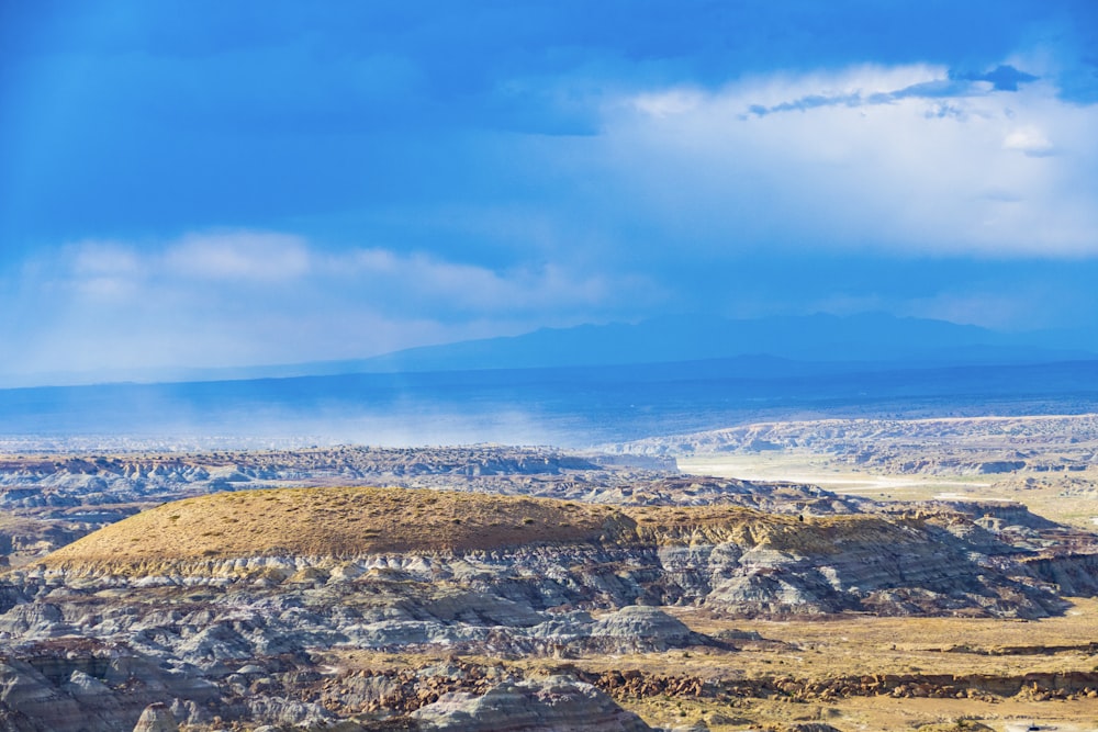 brown and white mountains under blue sky during daytime