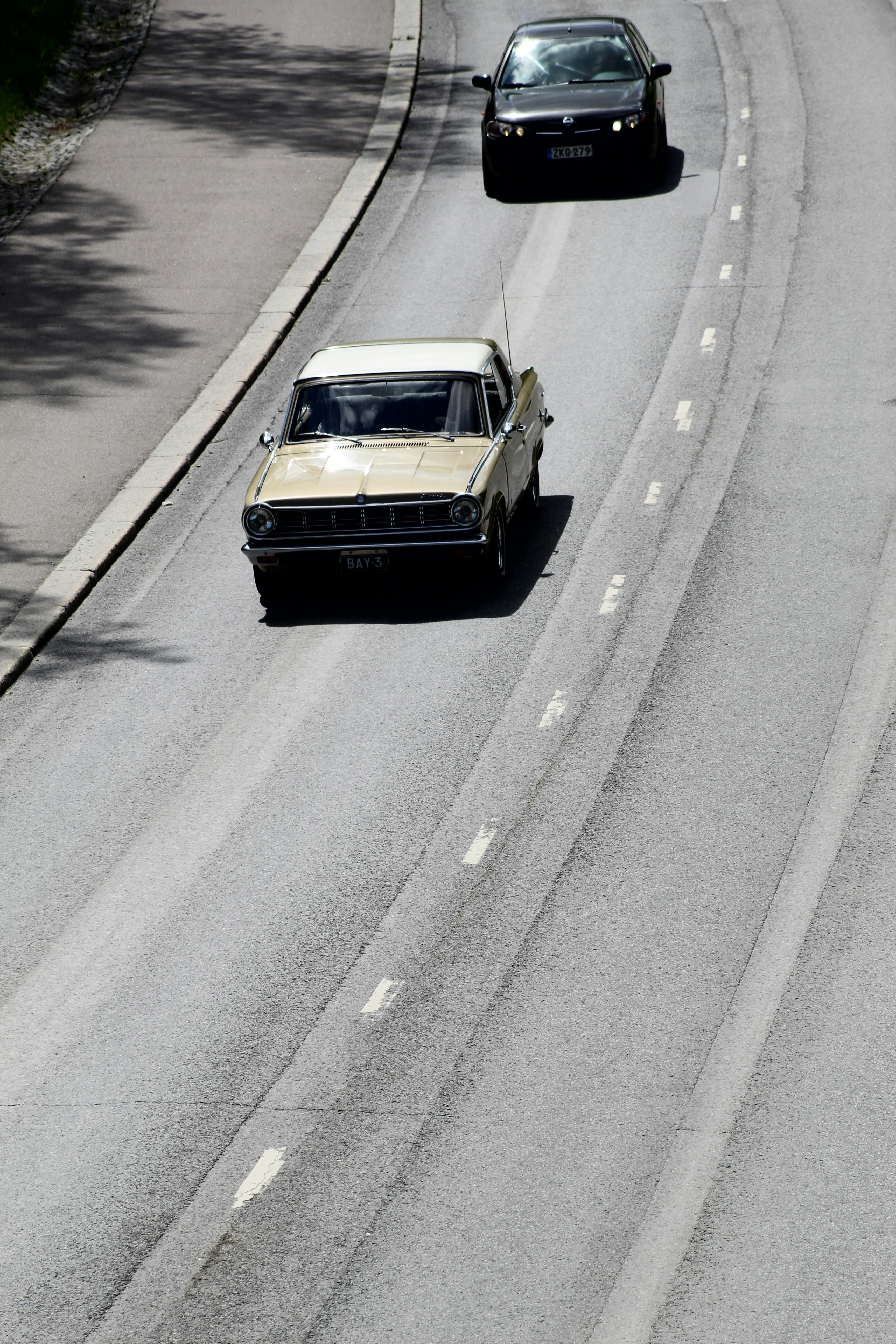 Black and white car on road during daytime
