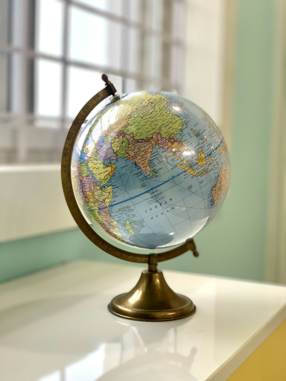 desk globe on white table