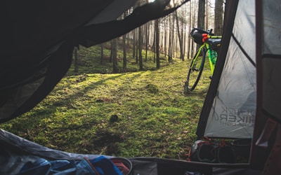 black mountain bike on green grass field