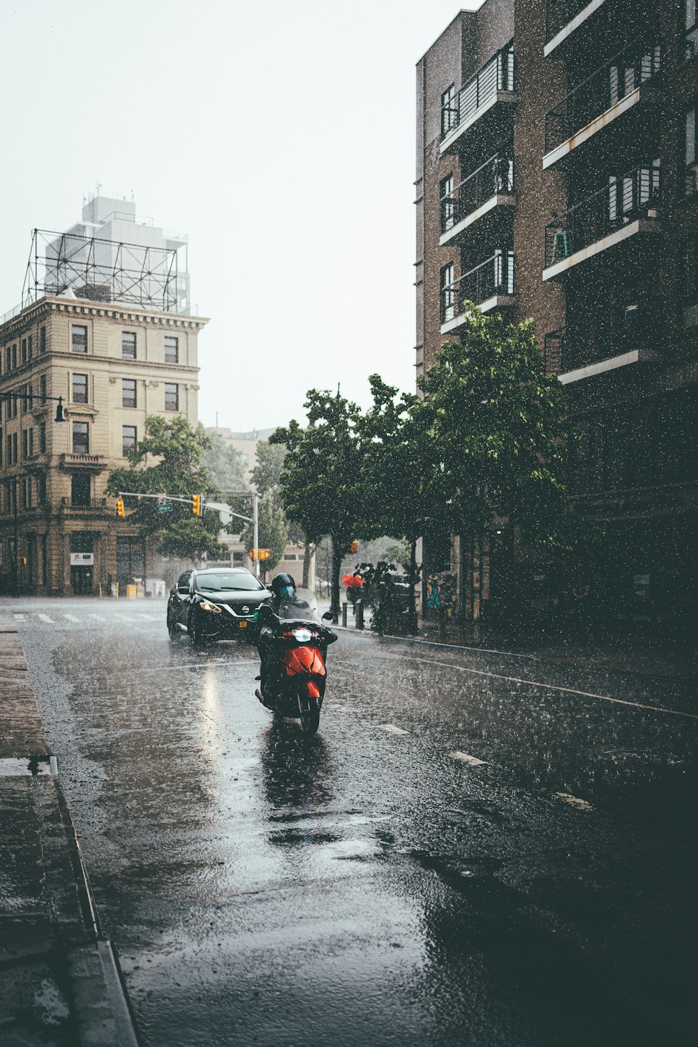 black and red motorcycle on road during daytime