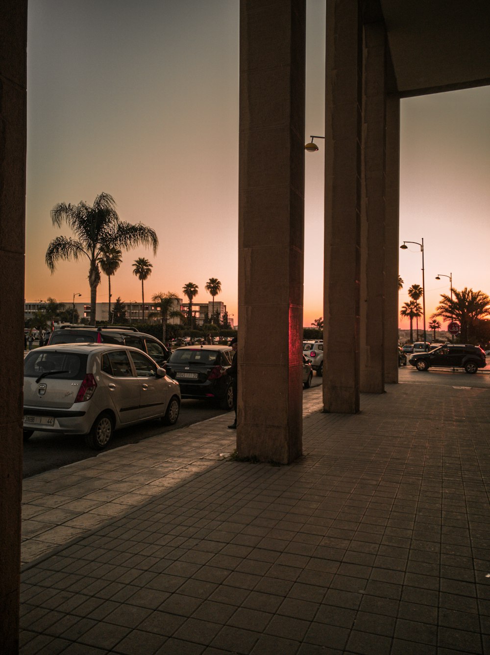 a parking lot filled with lots of parked cars