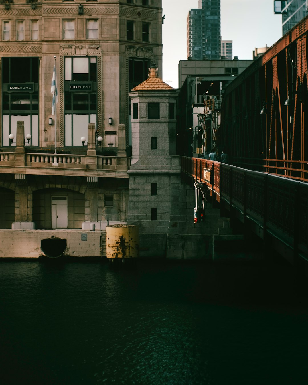 brown and white concrete building beside river during daytime