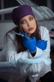 woman in white long sleeve shirt and blue hijab