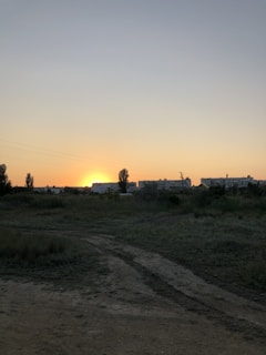Sunset over a quiet land plot available for sale in Sabya.