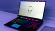 A high-performance gaming laptop with colorful RGB keyboard lighting.