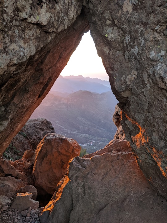 brown rock formation during daytime in Roque Nublo Spain