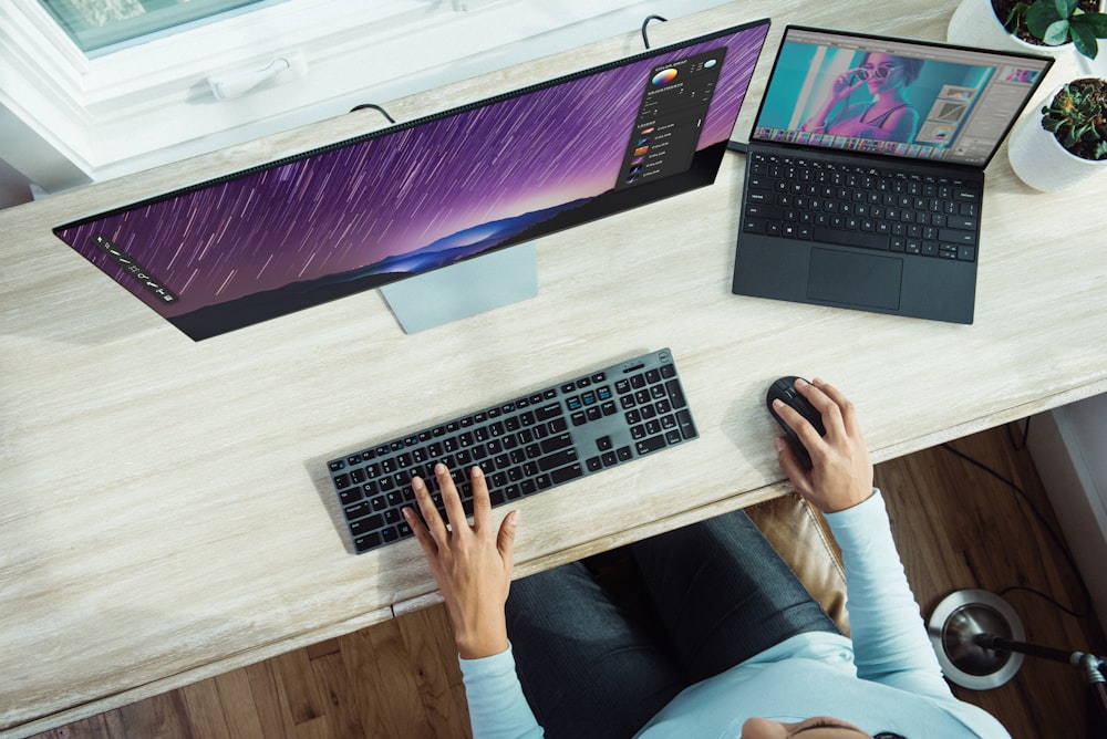 person using laptop on table