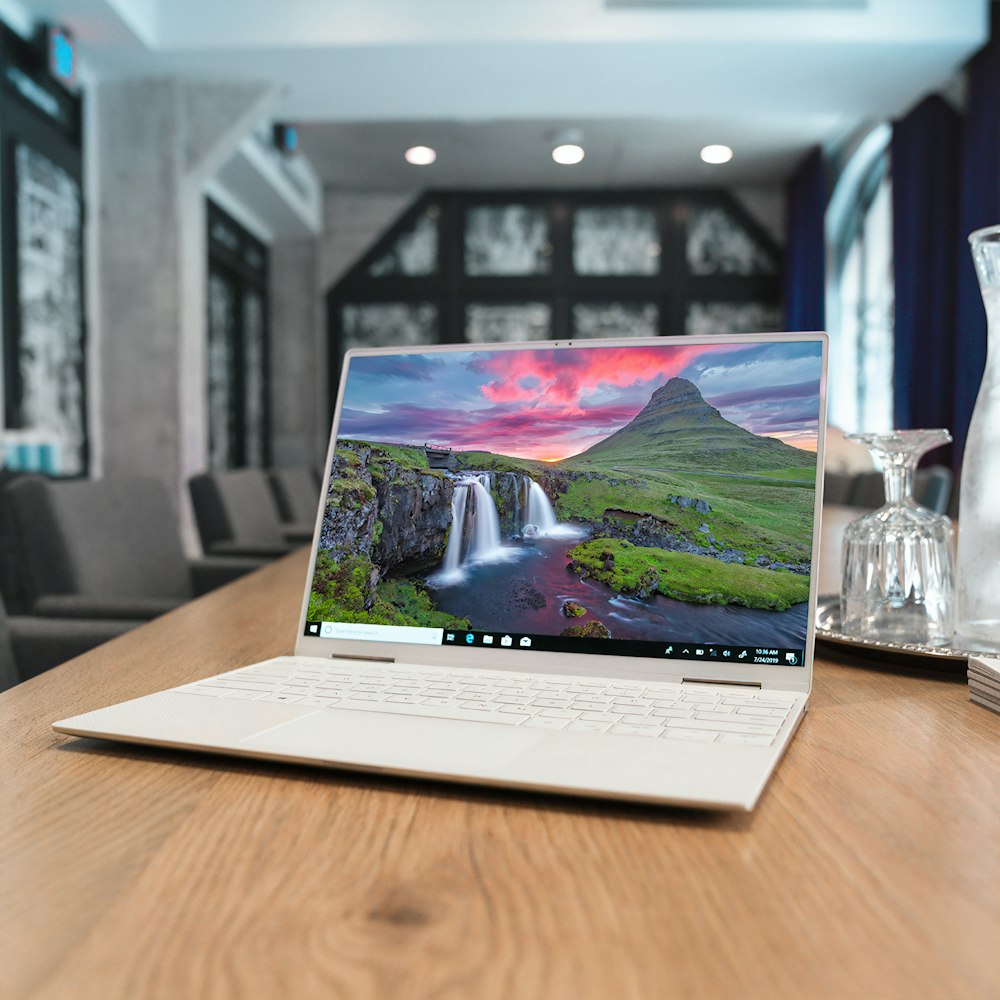 laptop on brown wooden table