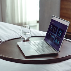 laptop on brown wooden table