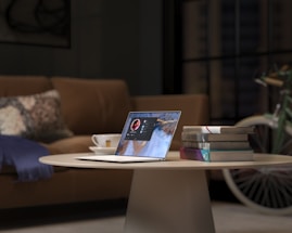 laptop on brown wooden table