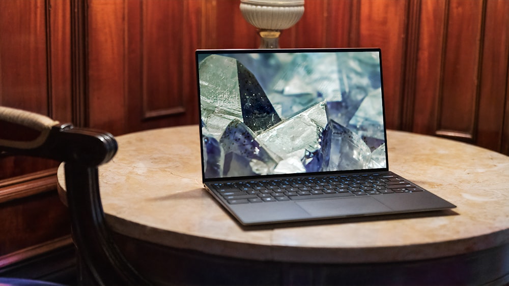 laptop on brown wooden table