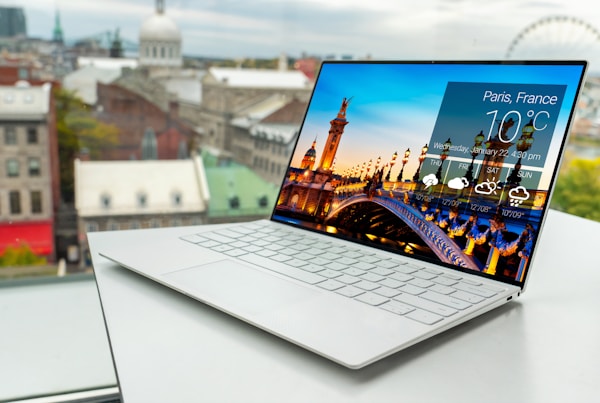 laptop on white table