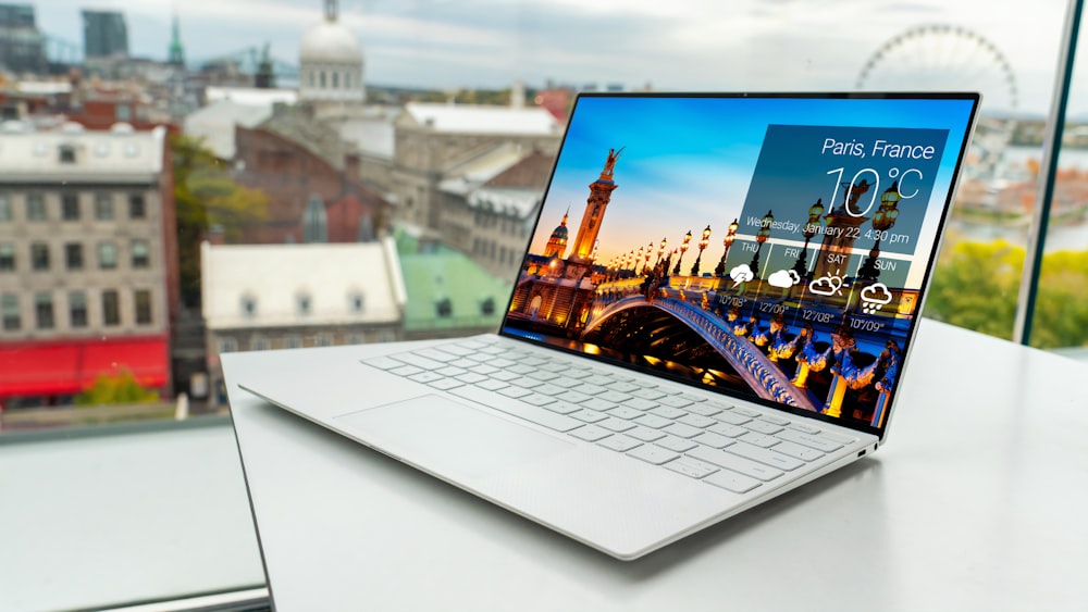 laptop on white table