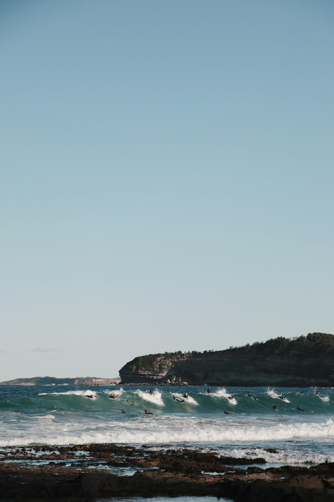 body of water under blue sky during daytime