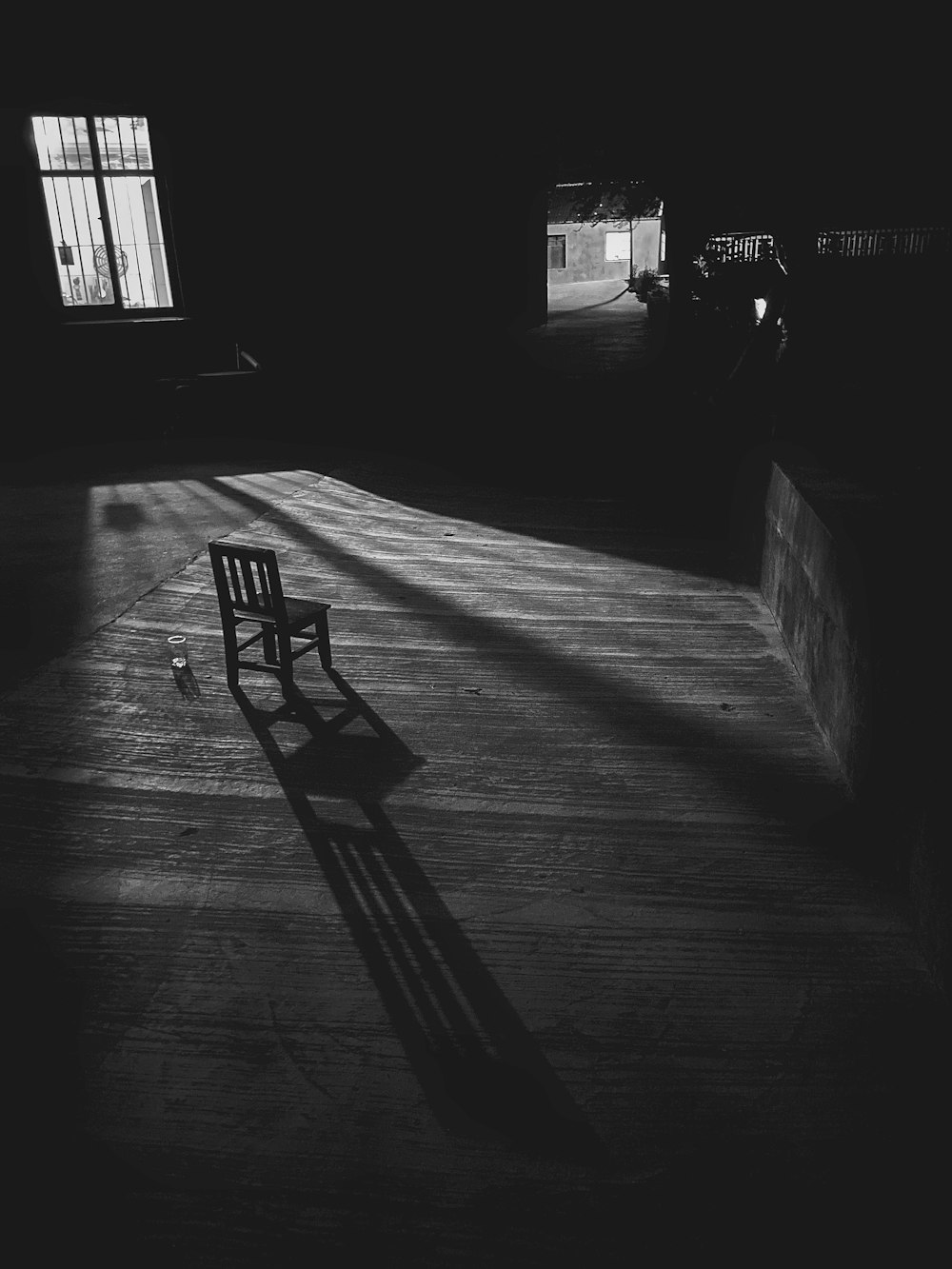 black chair on gray concrete floor