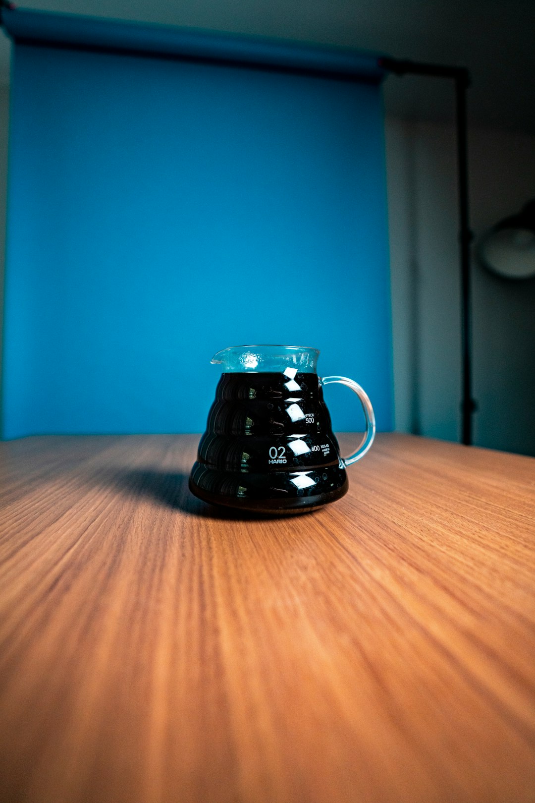 black ceramic mug on brown wooden table