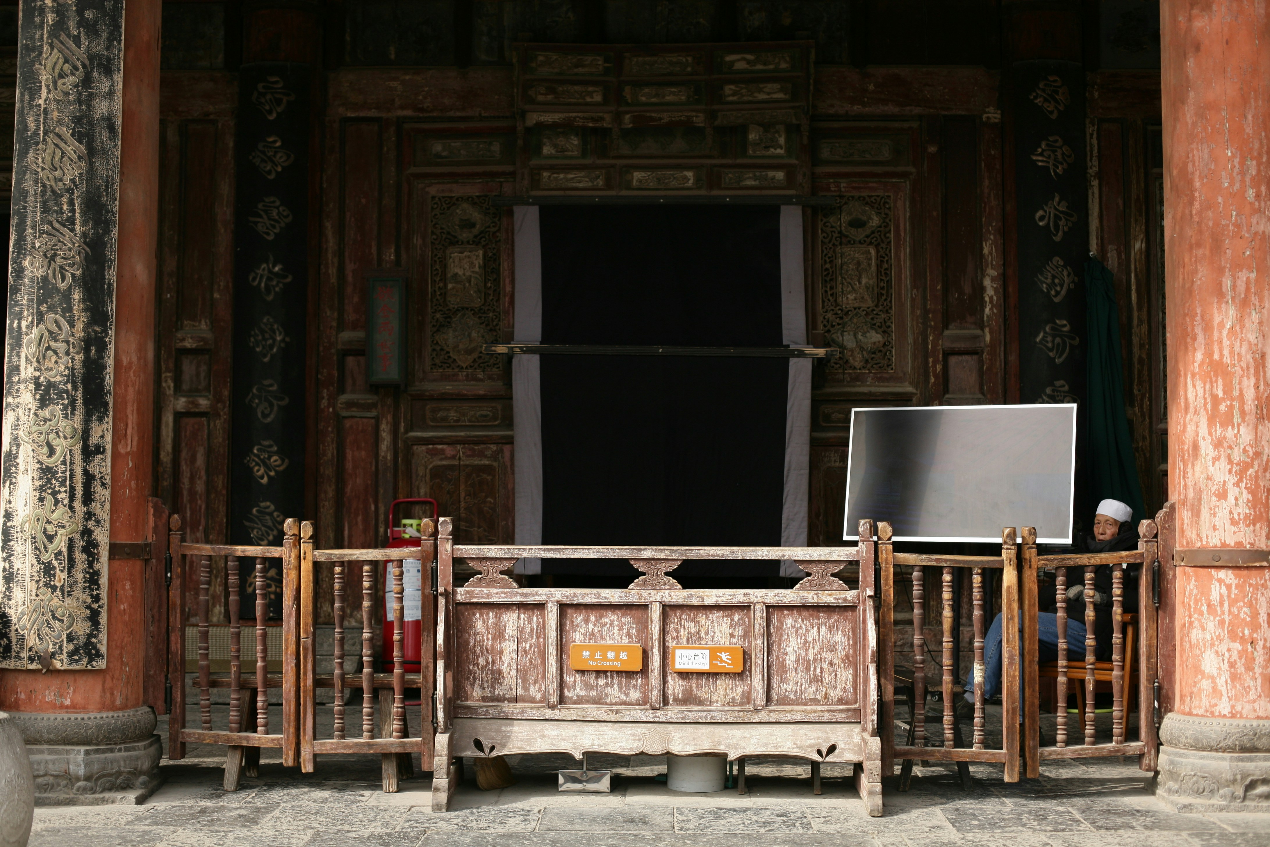 brown wooden bench in front of wooden door