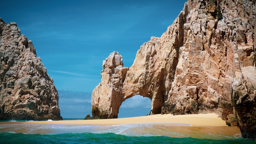 brown rock formation on sea during daytime