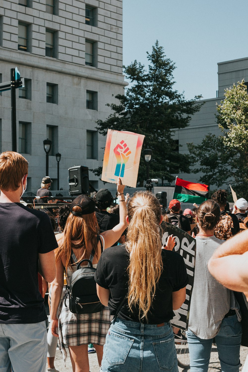 people gathering in the street during daytime