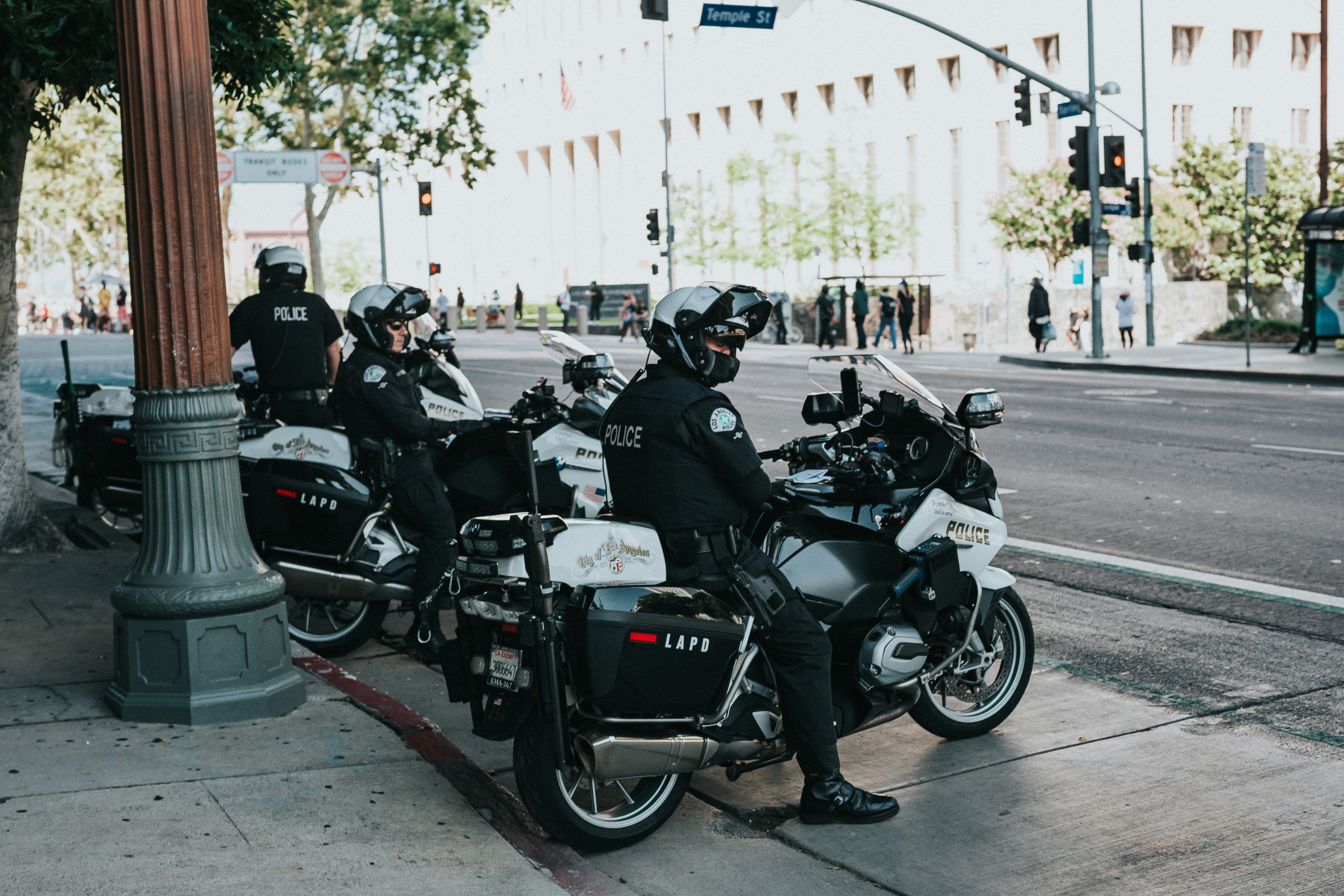 people riding on black motorcycle during daytime