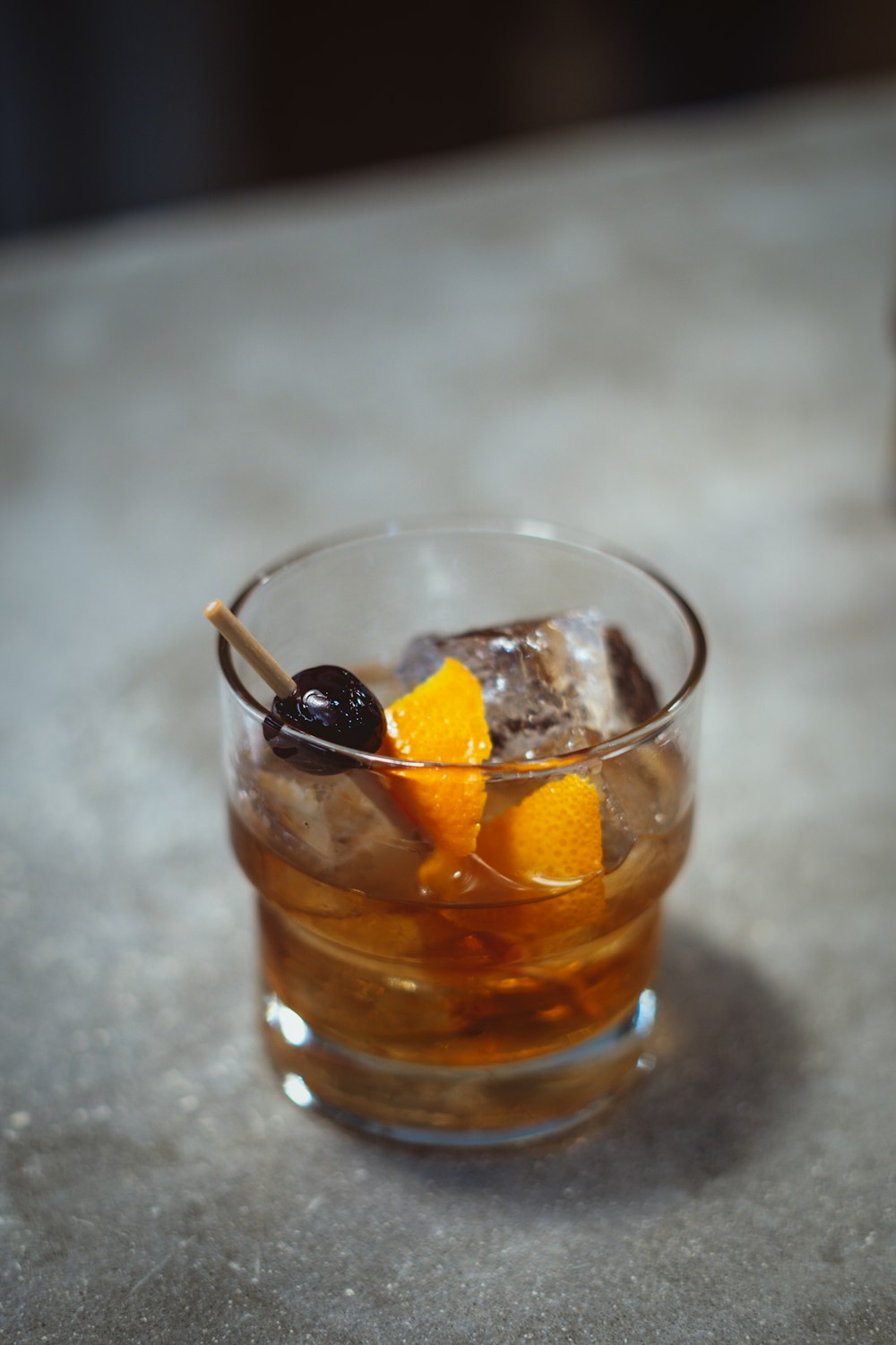 clear drinking glass with brown liquid