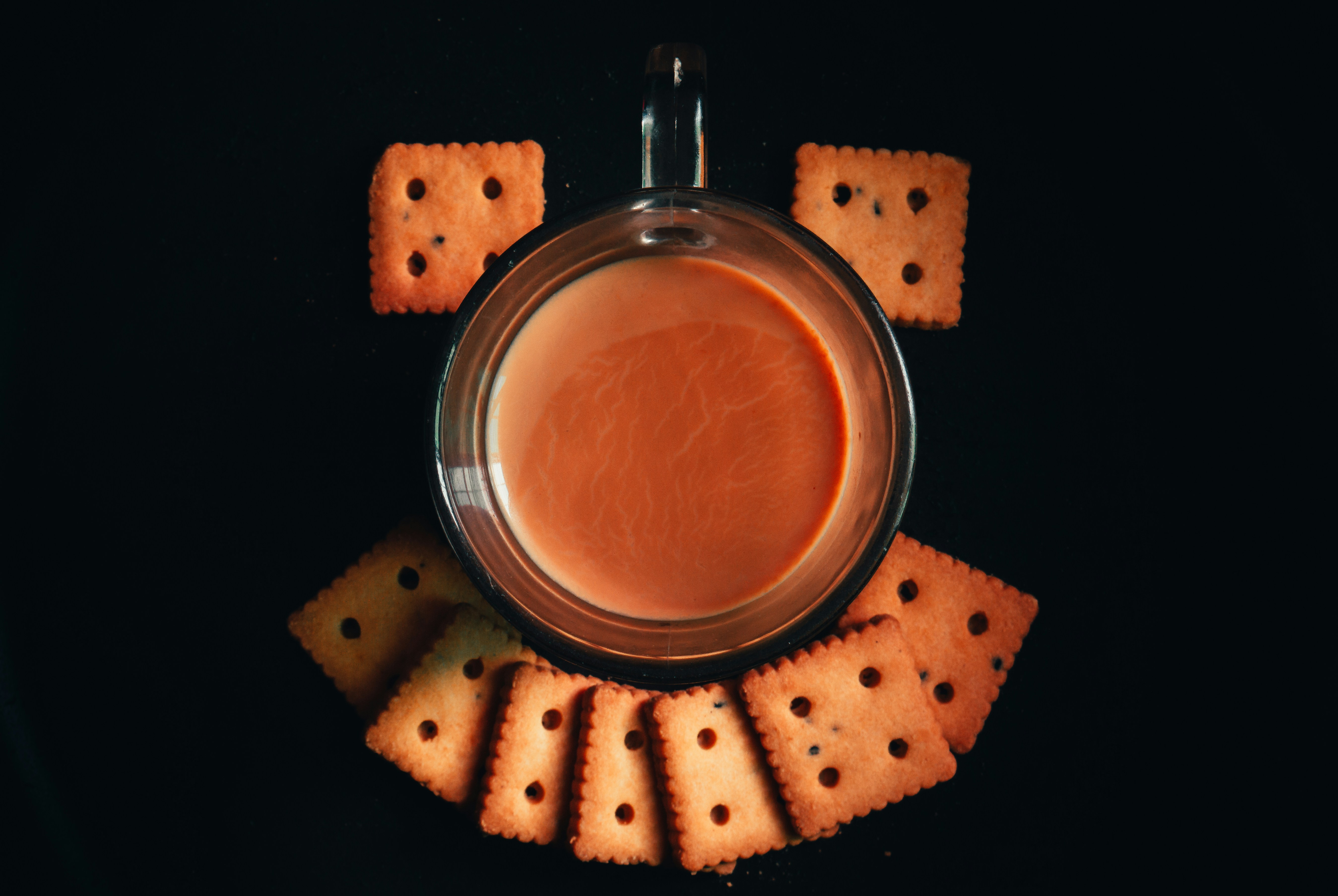 clear drinking glass with brown liquid inside