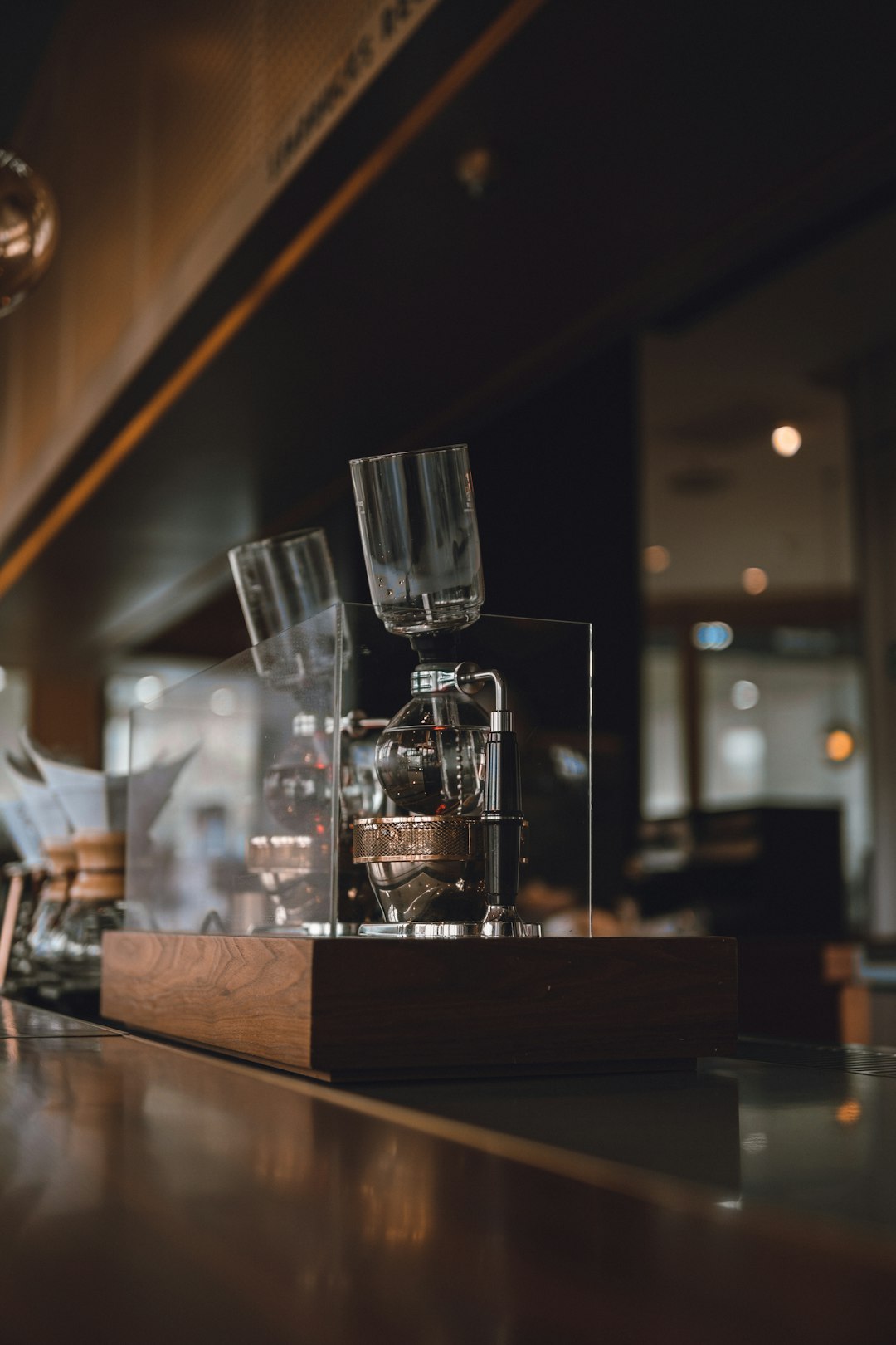 clear drinking glass on brown wooden table