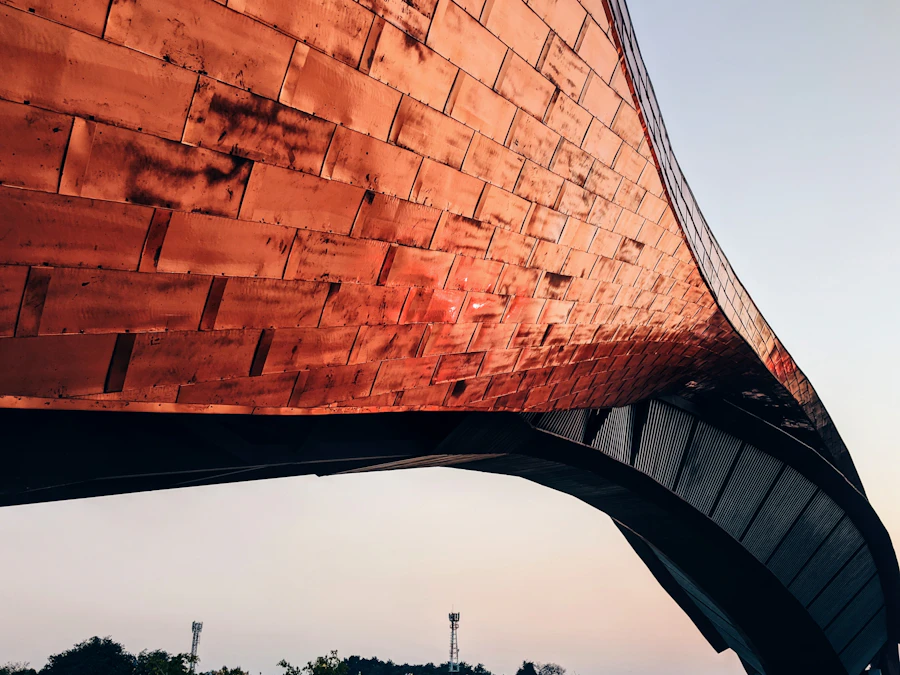 The curved underside of a copper roof edge