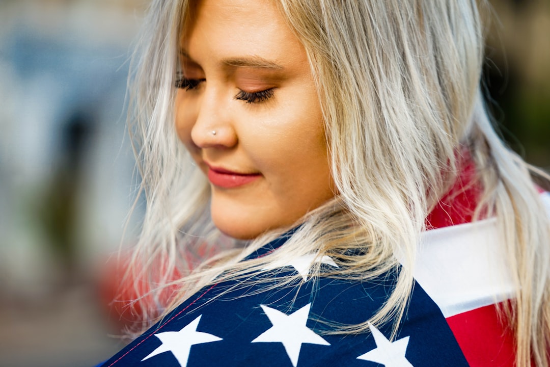 woman in blue and white star shirt