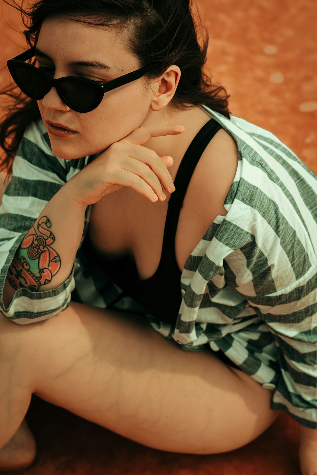 woman in black tank top and black sunglasses