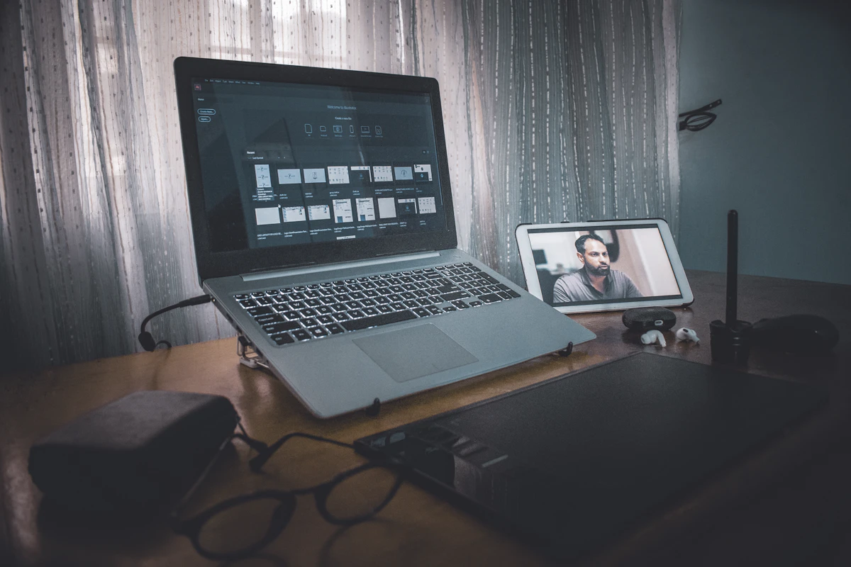 macbook pro on brown wooden table