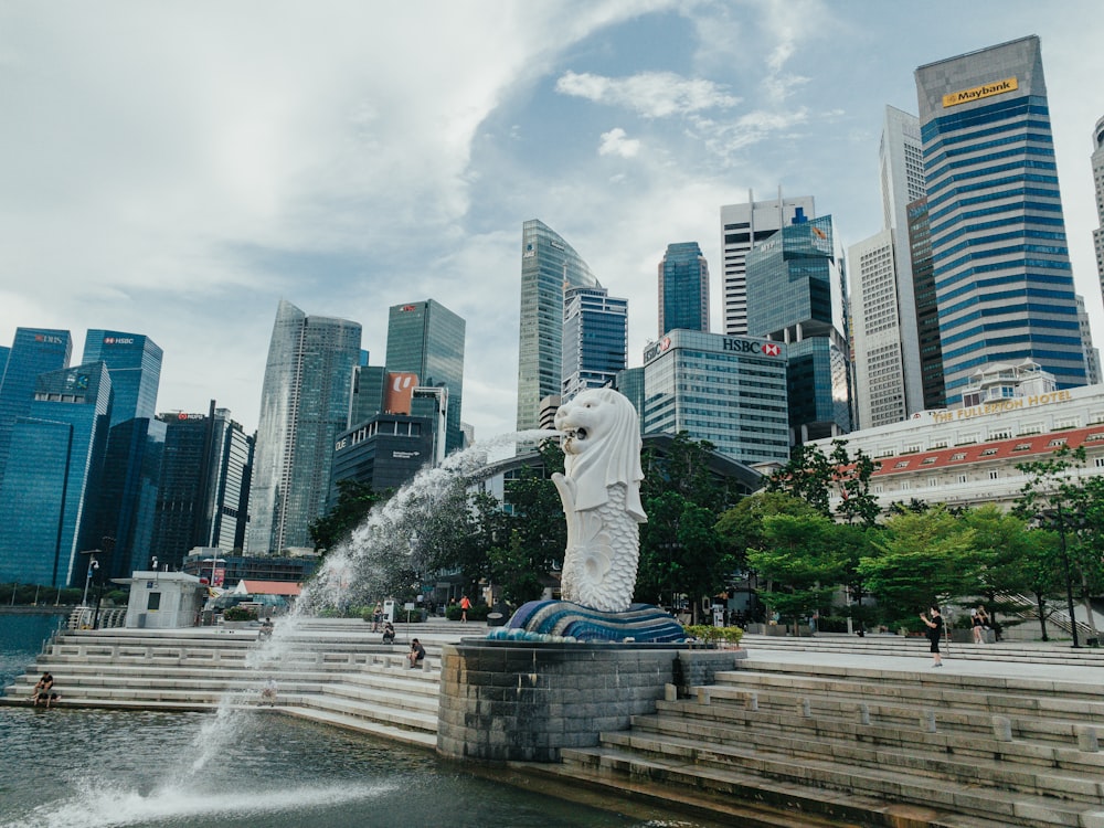 white statue of man on top of gray concrete blocks