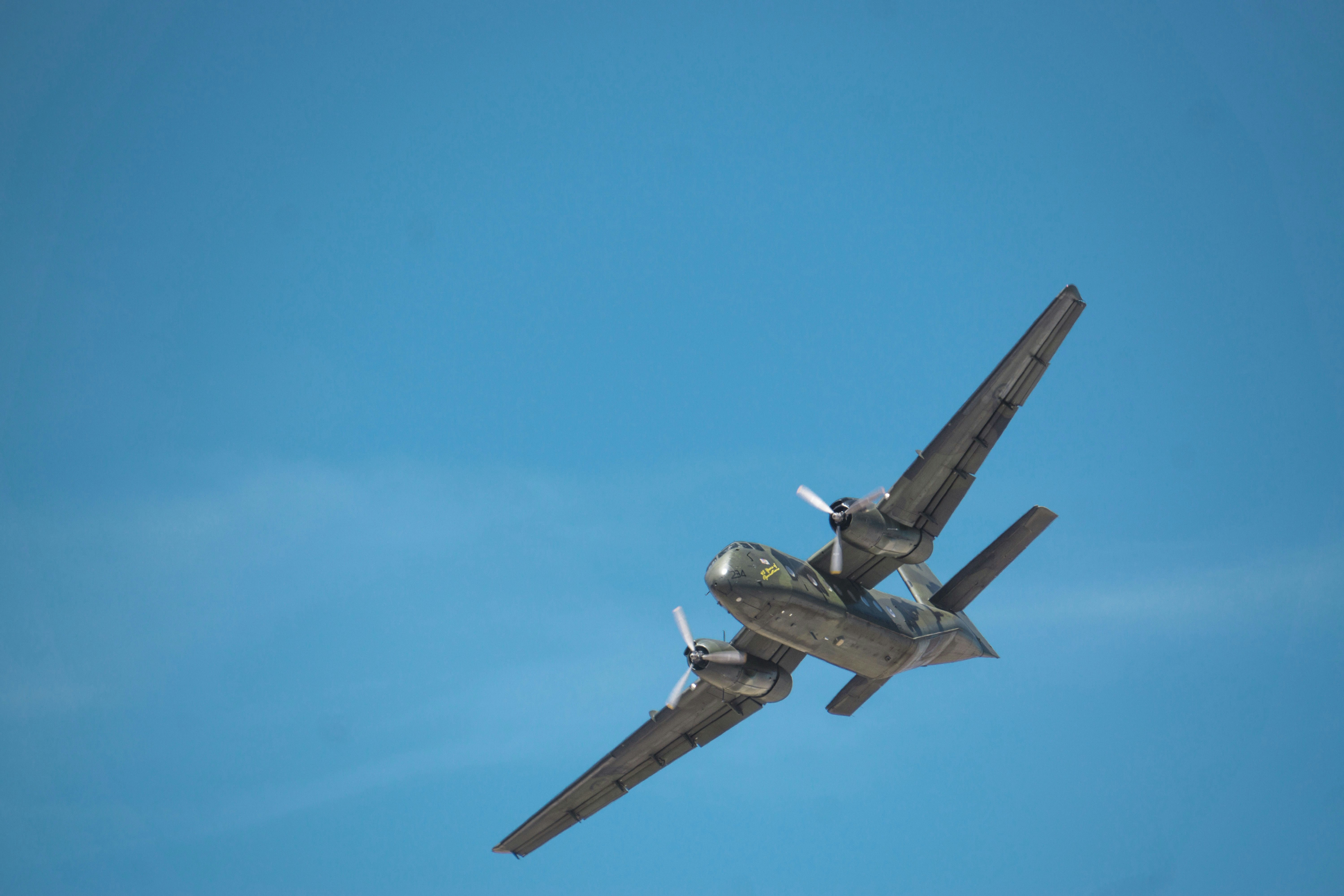 black and brown jet plane in mid air