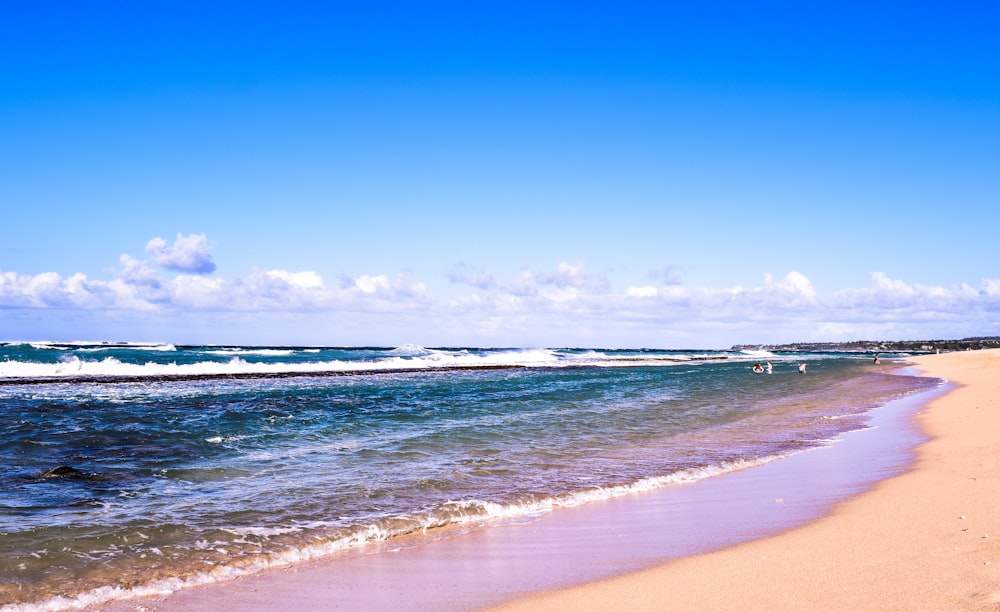 blue sea under blue sky during daytime