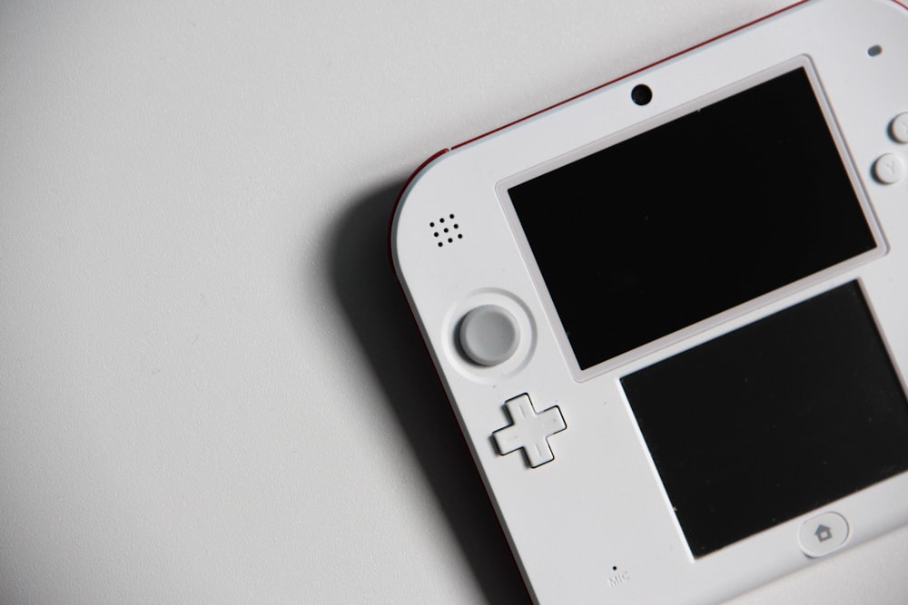 white nintendo game boy on white table