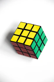 a rubik cube sitting on top of a white table